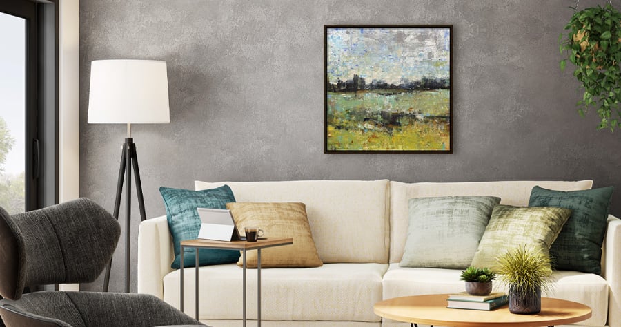 Across the tall grass art hanging over white couch linking to abstract artwork